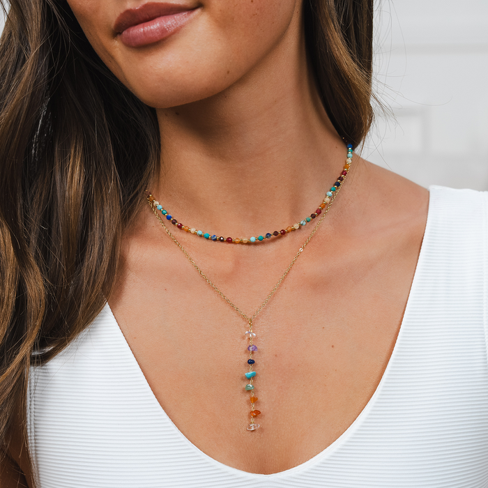 Divine Healer 3mm Healing Necklace, worn layered, white top