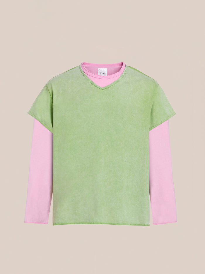 FOUND Double Layer LS Tee: a long-sleeve pink top layered under a short-sleeve green T-shirt with a sunfade wash, shown on a plain beige background.