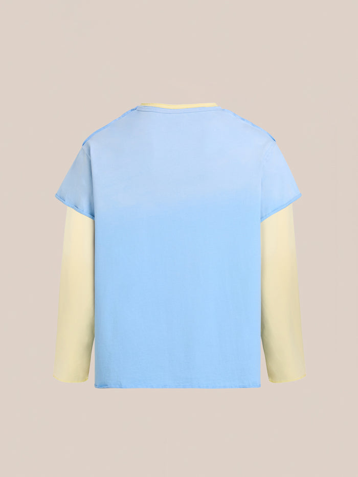 The FOUND Double Layer LS Tee features light yellow sleeves and a sunfade wash light blue body, shown against a plain beige background.