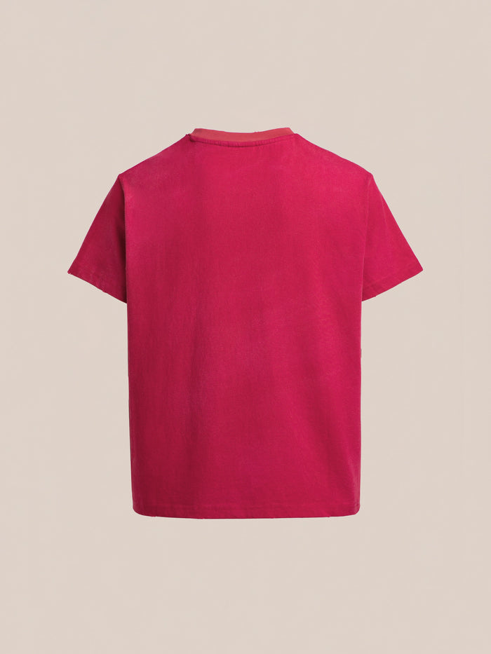 The FOUND Embroidered Wildlife Tee is a plain red short-sleeved shirt, shown from the back on a light beige background, featuring subtle chenille embroidery that adds nature-inspired artistry.