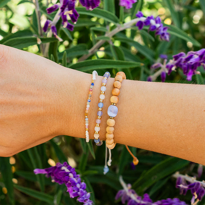 Euphoria 4mm Healing Bracelet, on wrist with flowers