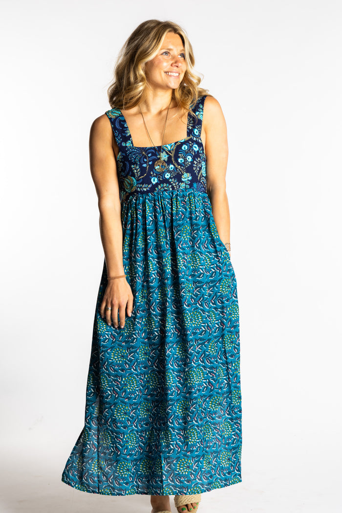 Sophie wearing the S/M teal floral Flora Fusion maxi dress