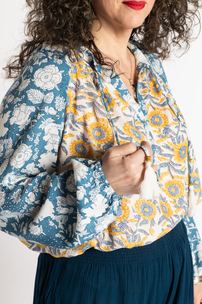 Susan is wearing the mixed print Sunflower boho floral poet blouse top