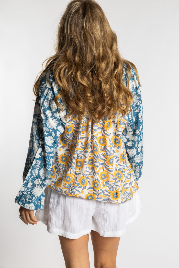 Sophie is wearing the mixed print sunflower boho floral poet blouse top