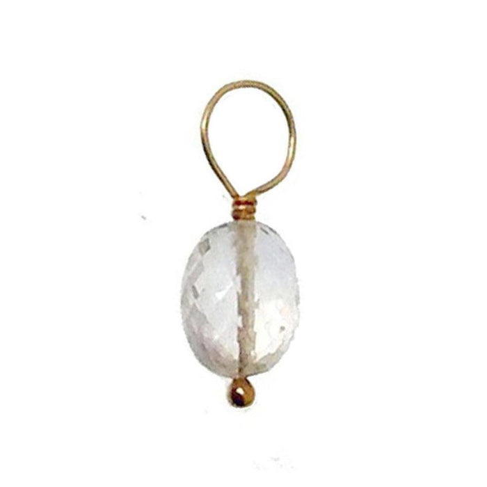 Clear quartz gemstone pendant with gold wire accents.