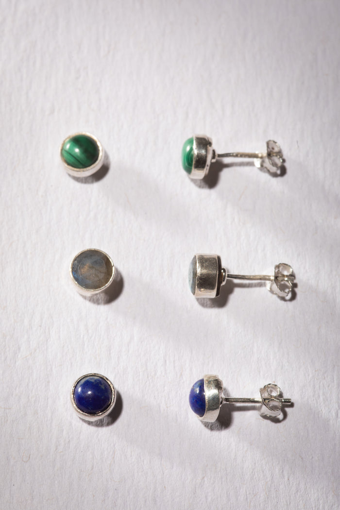 Gemstone earring stud trio in the theme of Transformation. The studs are Lapis, Labradorite, and Malachite