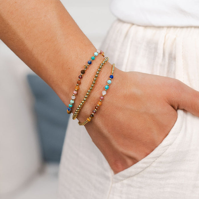 Gold 3mm Stretch Bead Bracelet, stacked on wrist