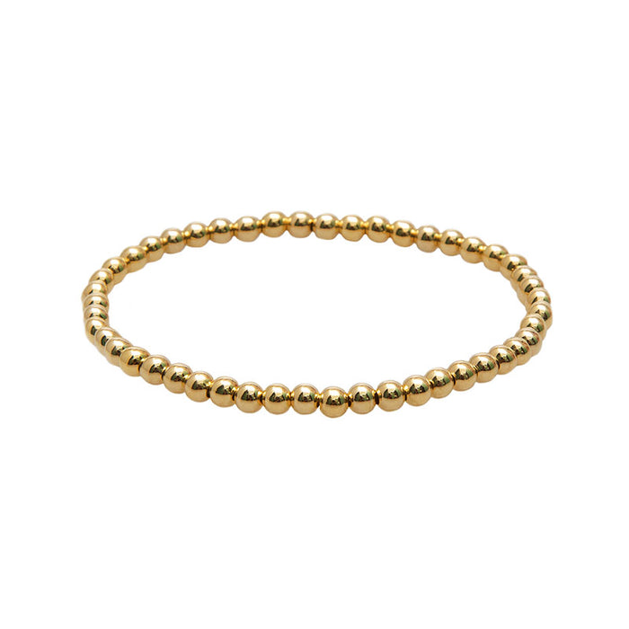 Gold 4mm Stretch Bead Bracelet, flat lay gold beads