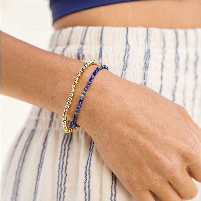 Gold 4mm Stretch Bead Bracelet, stacked on wrist with blue beads