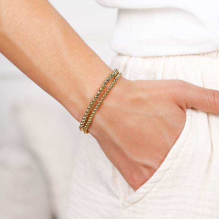 Gold 4mm Stretch Bead Bracelet, on wrist