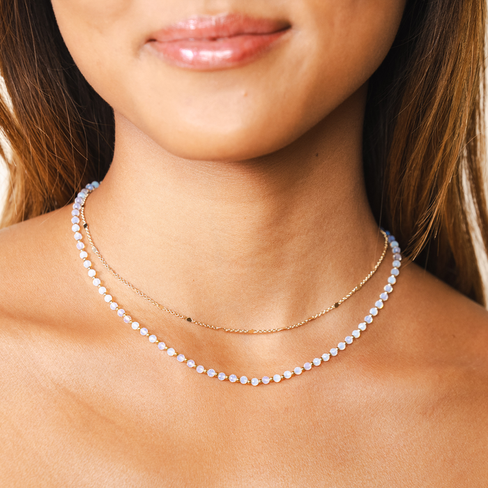Gold Moon Dancer 3mm Healing Necklace, layered on neck