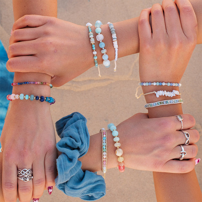 Good Vibes 3mm Healing Bracelet, on group of wrists