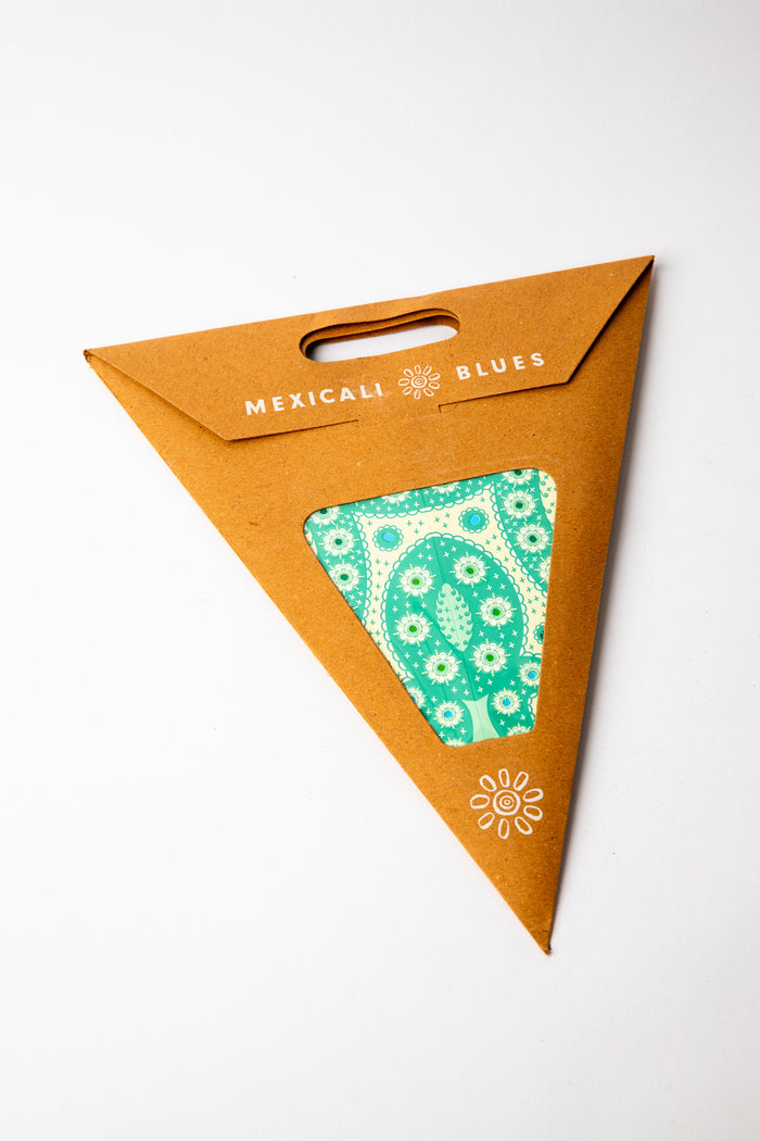 Green embroidered paper star, folded up, in packaging