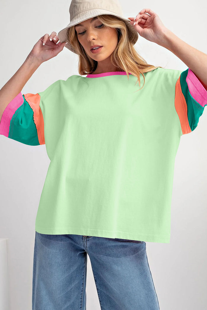 Haut oversize vert à manches et col rond avec coutures contrastées