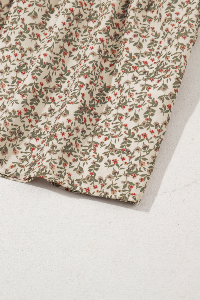 Haut smocké à manches bouffantes et imprimé floral