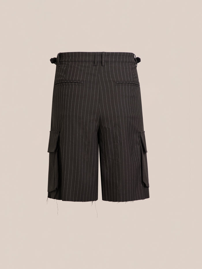 The FOUND Hava Pinstripe Pleated Cargo Trouser Shorts feature side pockets, raw hems, and an adjustable unisex fit. Shown against a plain beige background.