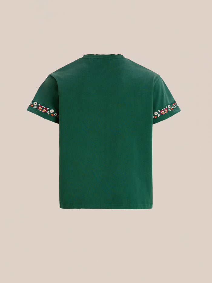 The FOUND Horse Equine Tee is a green short-sleeve shirt shown from the back, featuring floral embroidery and subtle embroidered horses along the sleeve edges.