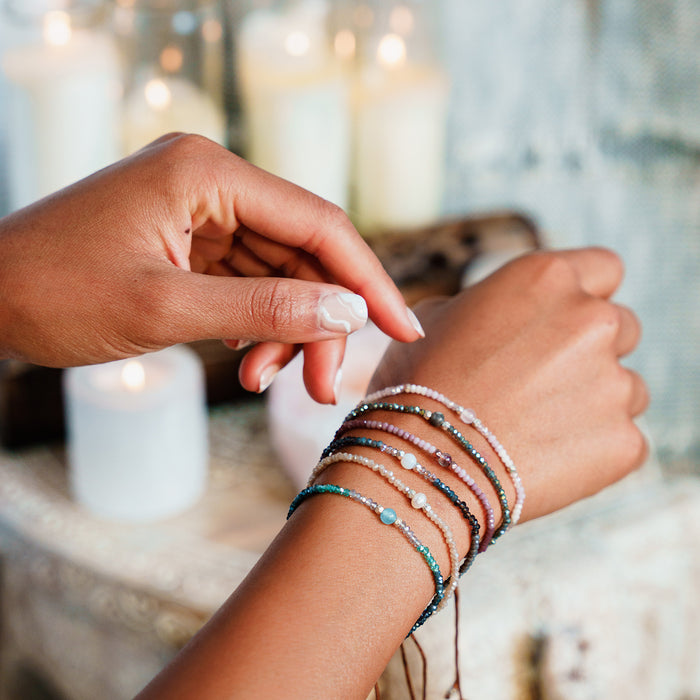 "I Love and Accept Myself as I am" Goddess Bracelet, stacked on wrist with candles