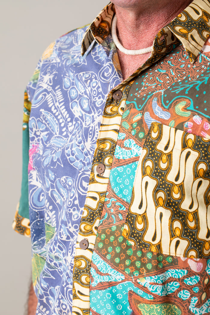 Ross is wearing the size L Patchwork button down shirt