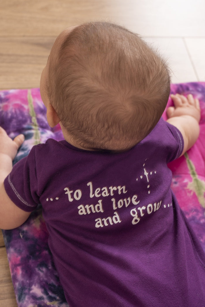 Marley is wearing a Jerry Garcia baby one piece