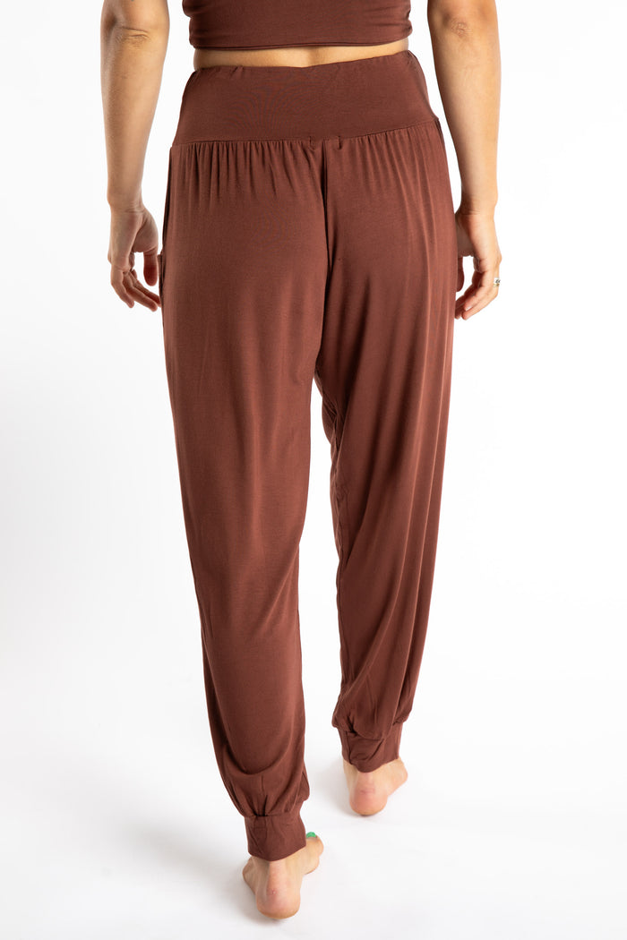 Sophie is wearing the Jum Jum Tapered Joggers in Brown in S/M