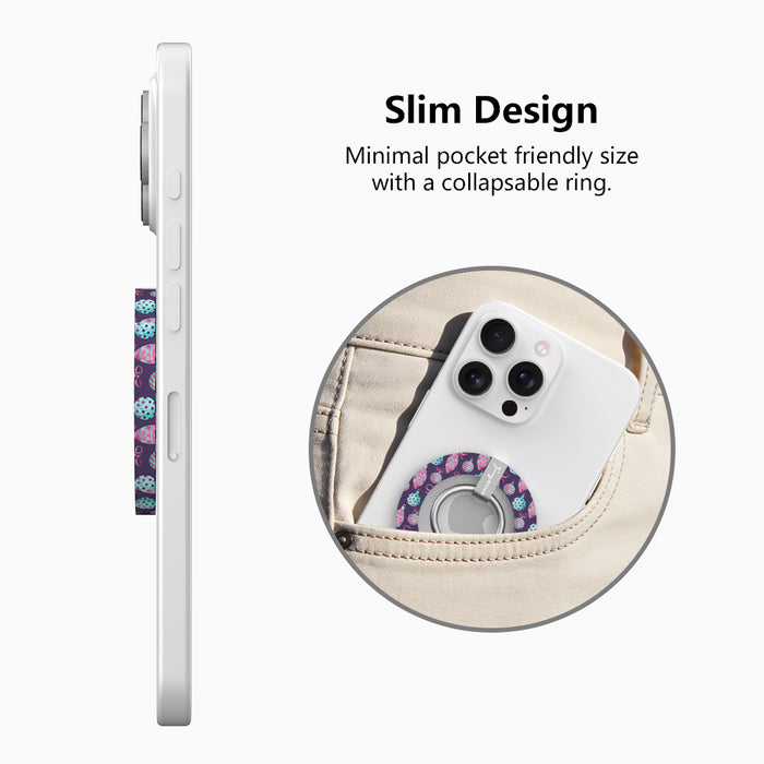 Side view of the slim Just One More Ornament grip ring with collapsible ring, and a phone with the ornament-print grip sliding into a jeans pocket