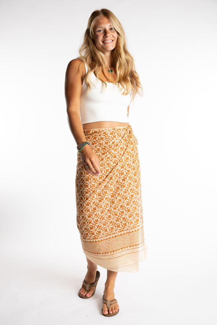 Sophie is wearing the Kala Cotton Sarong in Rust