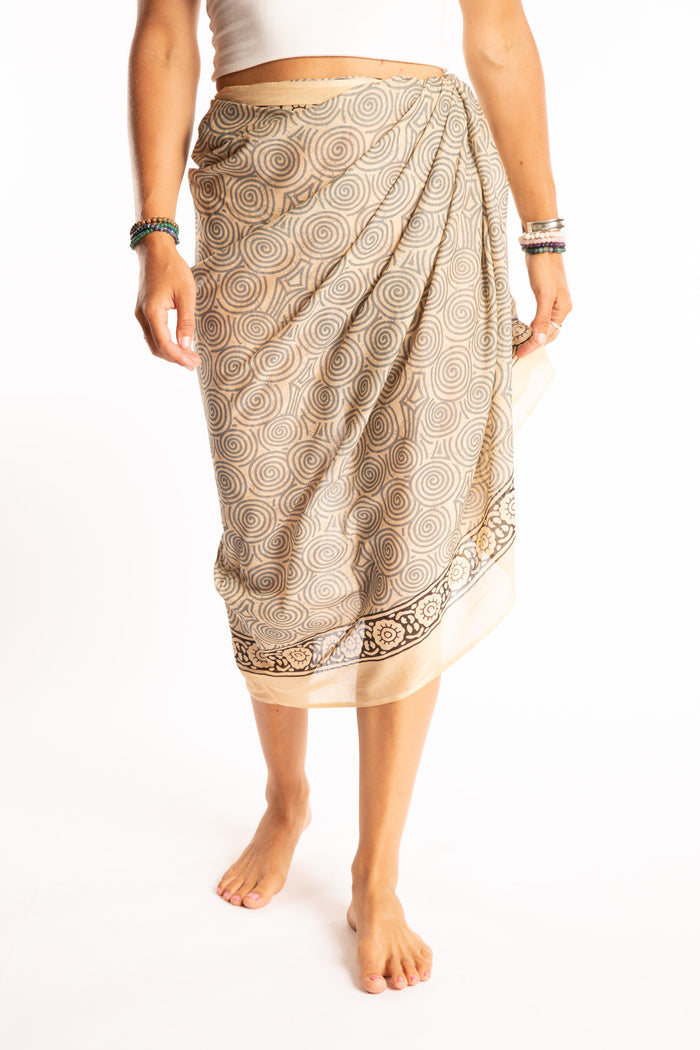 Sophie is wearing the Kala Cotton Sarong in Gray