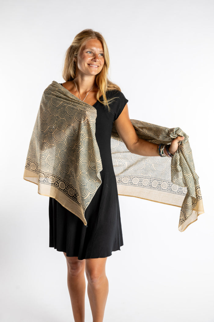 Sophie is wearing the Kala Cotton Sarong in Gray
