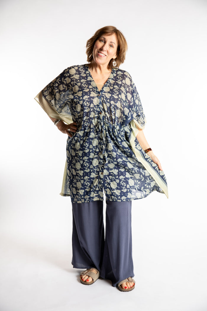 Betty is wearing the one size Kala Printed Cover Up in Blue