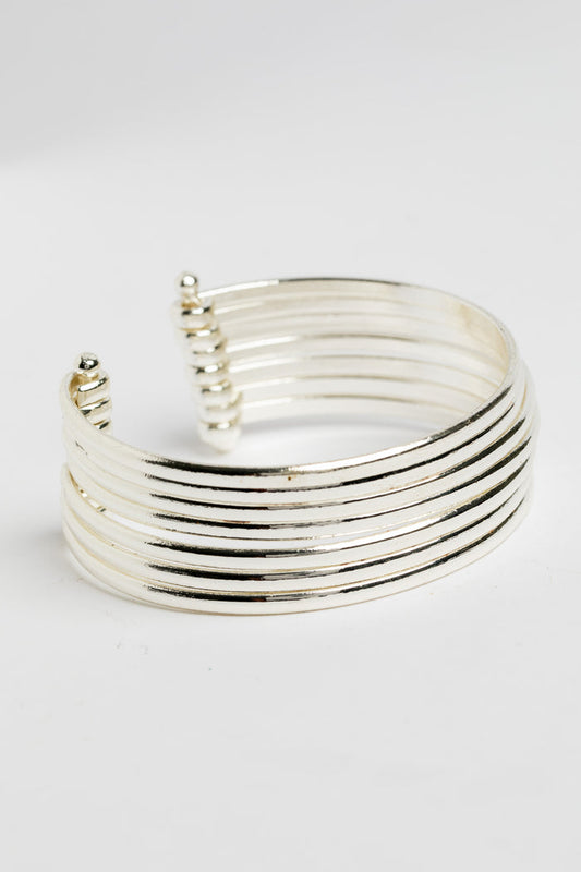 Bold statement wrist cuff in silver on white background