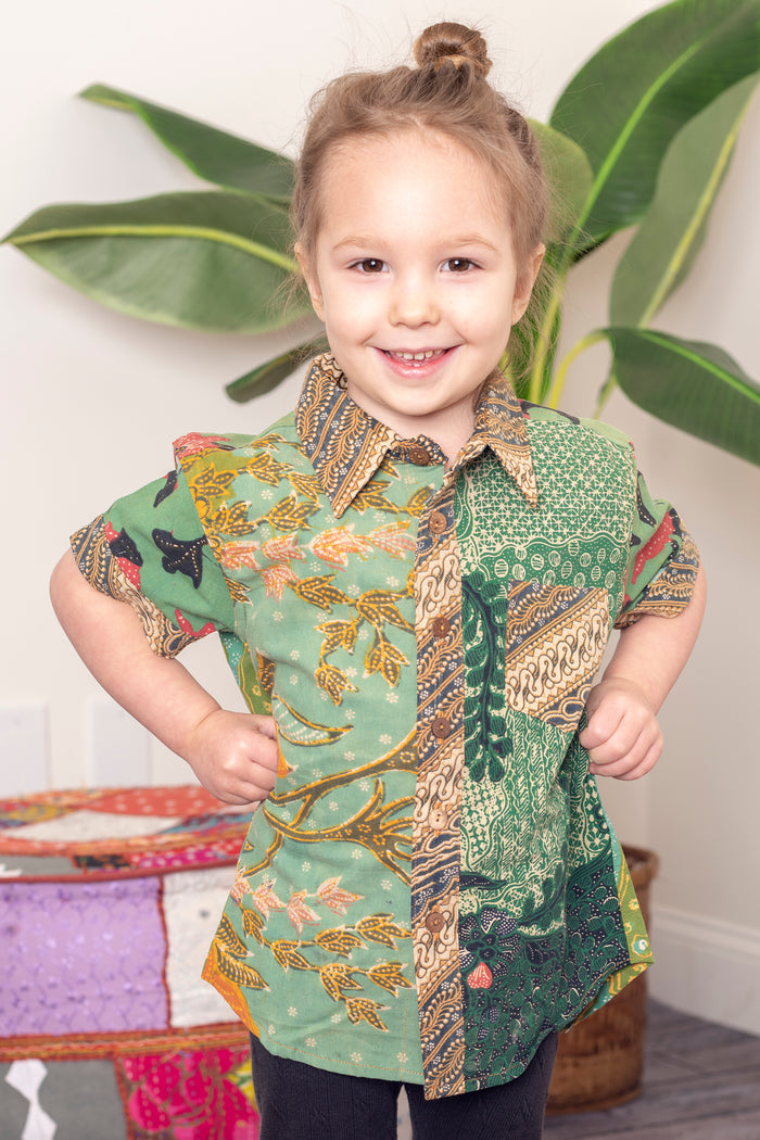 Sunshine wearing size M one of a kind patchwork button up shirt