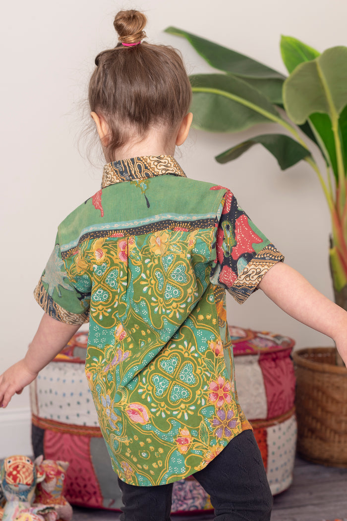 Sunshine wearing size M one of a kind patchwork button up shirt