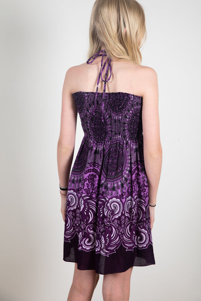 Harmony is wearing a kids convertible skirt in purple