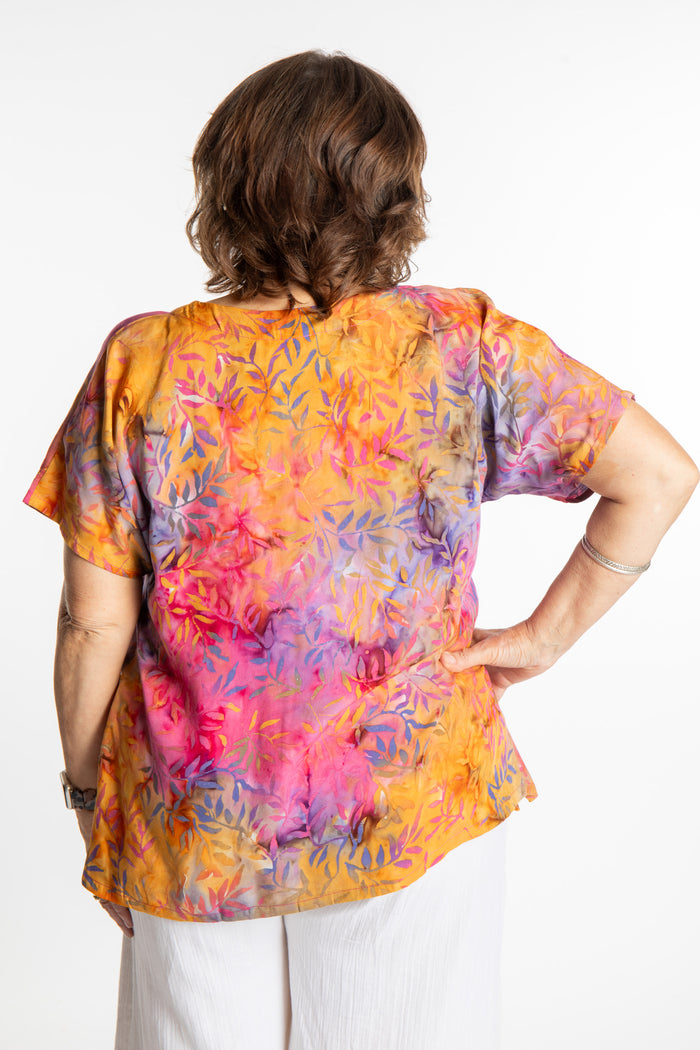Betty is wearing a size Large batik tunic in Watermelon