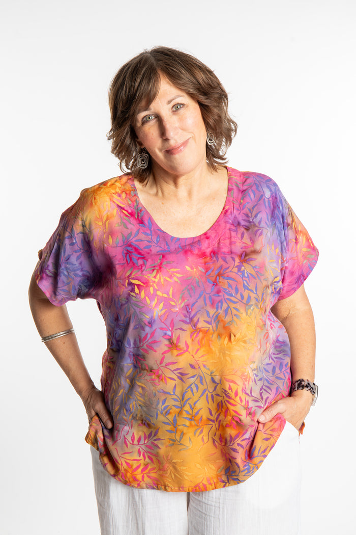 Betty is wearing a size Large batik tunic in Watermelon