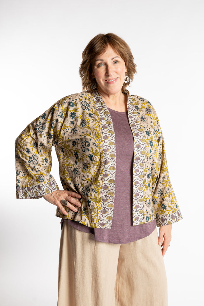 Betty is wearing the one size Kiraana cardigan in Tan