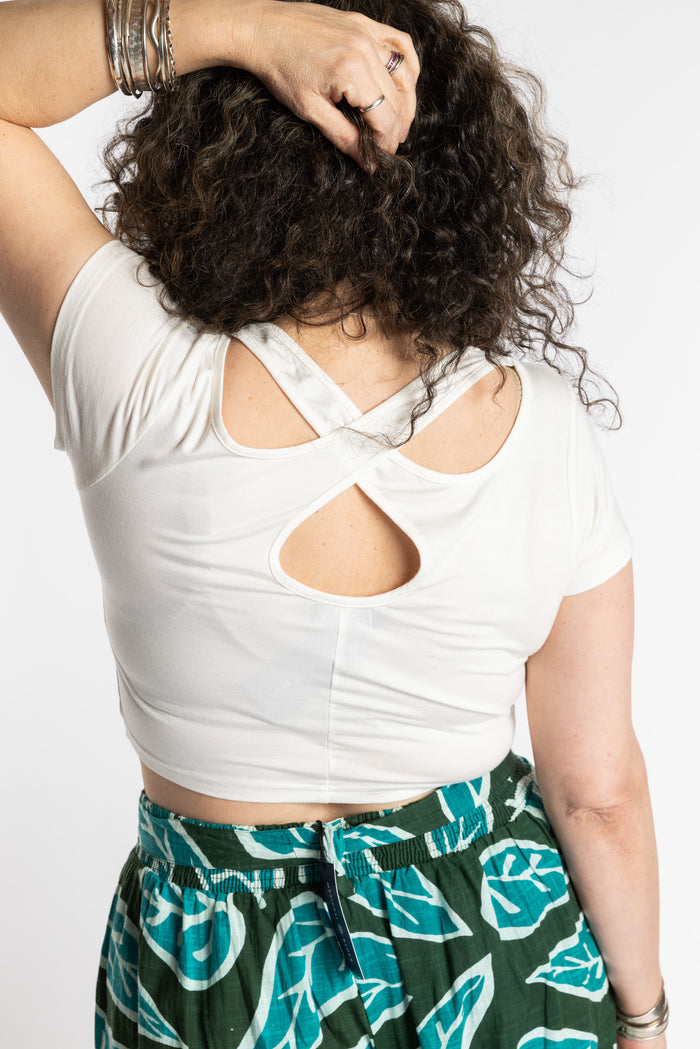 Susan is wearing the M/L white cross back crop top