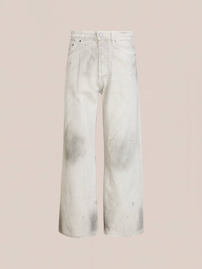 The FOUND Lacy Baggy Jeans are high-waisted, wide-leg white jeans featuring a relaxed fit and a distressed concrete wash with visible grayish stains, photographed against a plain light background.