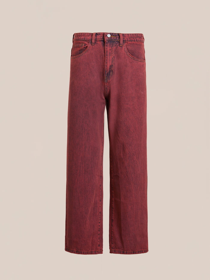 FOUND presents Lacy Baggy Jeans in vintage red wash with a button closure and front pockets. These unisex, wide-leg jeans offer timeless style, displayed against a plain backdrop.