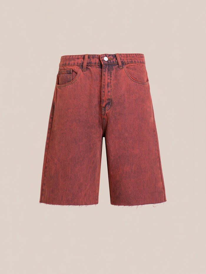 The FOUND Lacy Jean Jorts are vintage red wash shorts made from 100% cotton denim, featuring a raw hem, classic five-pocket style, and button closure, shown on a plain beige background.