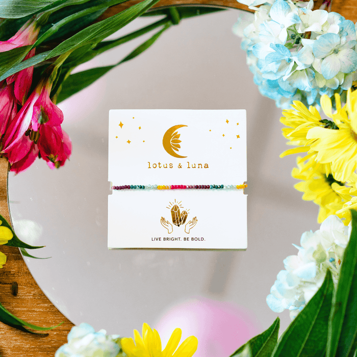 "Live Bright. Be Bold" Goddess Bracelet, on card with flowers