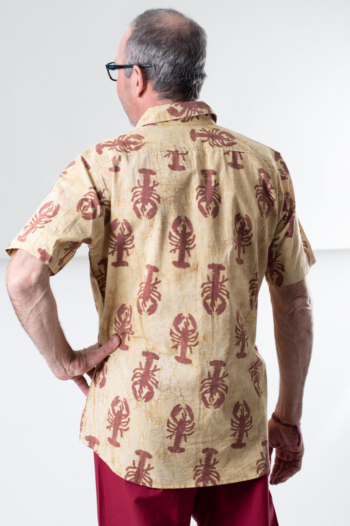 Ross is wearing size M lobster print button up in red