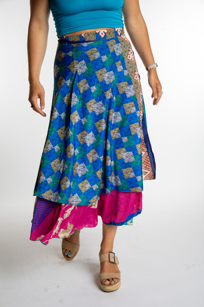 Sophie is wearing a long reversible silk wrap skirt in morning dew