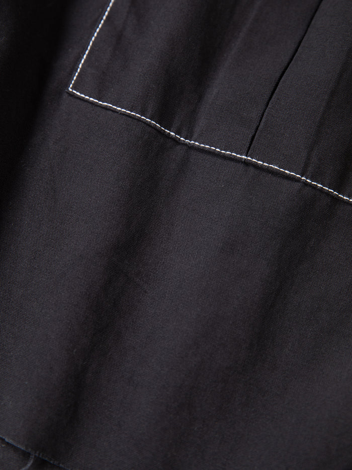 Close-up of FOUND Lucca Black Contrast Pocket Trouser Shorts, showcasing a relaxed fit, white seam stitching, and distinctive contrast pocket detail.