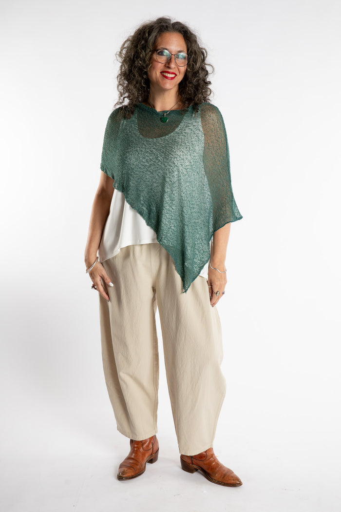 Susan is wear the Magic Lightweight Capelet in Teal