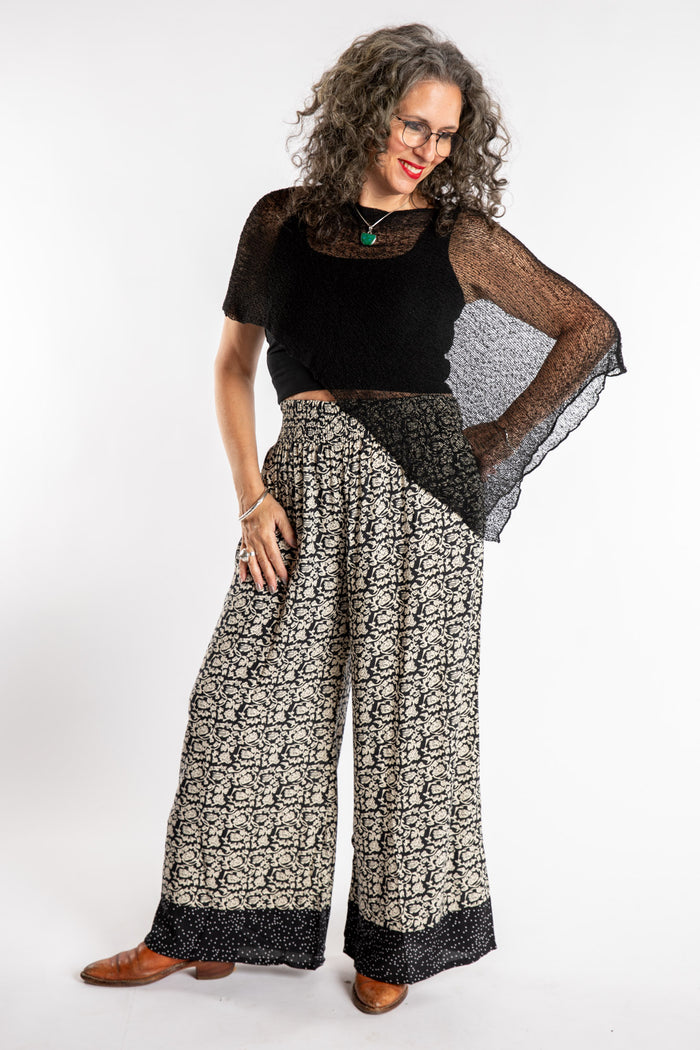 Susan is wear the Magic Lightweight Capelet in Black