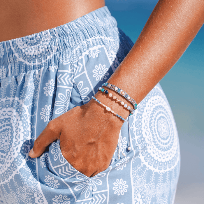 "Make Waves" Goddess Bracelet, stacked on wrist at beach