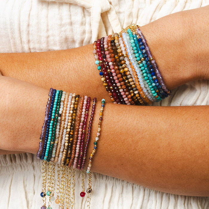 Master Healer 3mm Healing Bracelet, stacked on crossed arms