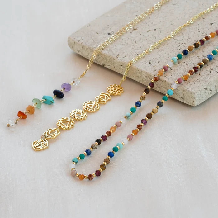 Master Healer 3mm Healing Necklace, flat lay on stone